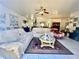 Spacious living room featuring comfortable seating, a ceiling fan, and decor at 3501 Pine Top Dr, Valrico, FL 33594
