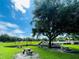 Picnic tables surround this playground, offering recreational activities for families with children at 3501 Pine Top Dr, Valrico, FL 33594