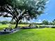 The community playground features picnic tables and lots of recreational activities for children at 3501 Pine Top Dr, Valrico, FL 33594
