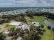 Expansive aerial view of the community featuring a golf course and various amenities nestled amidst lush greenery at 36731 Tara Ave, Zephyrhills, FL 33542