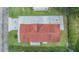 A top-down view of a home highlighting the roof, landscaping, and surrounding yard at 36731 Tara Ave, Zephyrhills, FL 33542