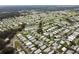 Wide aerial perspective of the residential area featuring an array of manufactured homes and picturesque ponds at 36731 Tara Ave, Zephyrhills, FL 33542