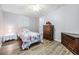 Charming bedroom with a single bed, dresser, and ceiling fan offers a cozy retreat at 36731 Tara Ave, Zephyrhills, FL 33542