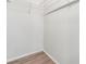 A spacious walk-in closet features laminate wood flooring and wire shelving for optimal organization at 36731 Tara Ave, Zephyrhills, FL 33542