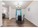 Well-lit dining room with modern flooring and doorway to living room at 36731 Tara Ave, Zephyrhills, FL 33542