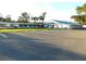 Property featuring ample parking, well-maintained landscaping, and a modern building design at 36731 Tara Ave, Zephyrhills, FL 33542
