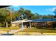 Charming brick building with well-maintained lawn and mature trees in a sunny setting at 36731 Tara Ave, Zephyrhills, FL 33542