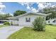Charming single-story home featuring a carport, green lawn, and cozy curb appeal at 36731 Tara Ave, Zephyrhills, FL 33542