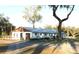 Inviting building featuring a garage, manicured lawn, mature trees, and easy accessibility at 36731 Tara Ave, Zephyrhills, FL 33542