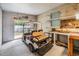 Spacious garage with a golf cart, workbench, and ample storage space at 36731 Tara Ave, Zephyrhills, FL 33542