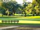 Beautiful golf course view with mature trees and open green spaces at 36731 Tara Ave, Zephyrhills, FL 33542