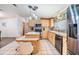 Bright kitchen with stainless steel appliances, breakfast bar, and pendant lighting at 36731 Tara Ave, Zephyrhills, FL 33542