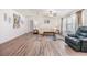 Bright living room with ceiling fan, modern flooring, and lots of natural light at 36731 Tara Ave, Zephyrhills, FL 33542