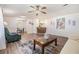 Open-concept living room with views of kitchen, dining area, and modern wood-style floors at 36731 Tara Ave, Zephyrhills, FL 33542