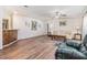 The living room features laminate wood flooring with colorful decor in an inviting space at 36731 Tara Ave, Zephyrhills, FL 33542