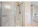 A clean, functional shower with a clear sliding glass door stands ready for a refreshing start to the day at 36731 Tara Ave, Zephyrhills, FL 33542