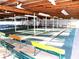 Well-lit shuffleboard courts with benches, ideal for leisure and social gatherings at 36731 Tara Ave, Zephyrhills, FL 33542