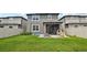 Spacious backyard featuring a well-manicured lawn, gray exterior and playful playground at 37820 Beacon Brick Dr, Zephyrhills, FL 33540