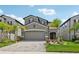 Charming two-story home features a well-manicured lawn, brick paver driveway, and neutral exterior paint at 37820 Beacon Brick Dr, Zephyrhills, FL 33540