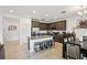 Beautiful kitchen features stainless steel appliances, granite countertops, and a kitchen island with seating at 37820 Beacon Brick Dr, Zephyrhills, FL 33540