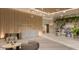 Modern lobby with wood accents, designer lighting, marble reception desk, and comfortable seating areas at 400 Central Ave # 2705, St Petersburg, FL 33701