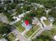 Aerial view pinpoints home nestled in a mature neighborhood with tree-lined streets at 410 N Corona Ave, Clearwater, FL 33765