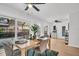 Bright dining room with seating for four and sliding glass doors to the backyard pool at 410 N Corona Ave, Clearwater, FL 33765