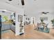 Open-concept living area with sleek wood floors, modern lighting, and inviting dining area at 410 N Corona Ave, Clearwater, FL 33765