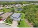 An aerial view of the property showing the neighborhood and surrounding trees at 4151 Little Gap Loop, Ellenton, FL 34222
