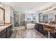 Bright bathroom featuring a glass shower, soaking tub, and double sink vanity at 4151 Little Gap Loop, Ellenton, FL 34222