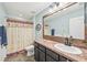 Bathroom with a shower, toilet and a large vanity with a sink at 4151 Little Gap Loop, Ellenton, FL 34222