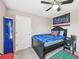 Bedroom with a sports themed decor and a ceiling fan at 4151 Little Gap Loop, Ellenton, FL 34222