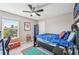 Bedroom with natural light, sports decor and furniture at 4151 Little Gap Loop, Ellenton, FL 34222