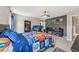Bedroom with sports memorabilia and display shelves for equipment at 4151 Little Gap Loop, Ellenton, FL 34222