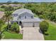 Beautiful two-story home with a three car garage and lush landscaping at 4151 Little Gap Loop, Ellenton, FL 34222
