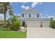 Beautiful two-story home featuring a three car garage and a well-manicured lawn at 4151 Little Gap Loop, Ellenton, FL 34222