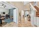 Bright foyer with tall ceilings opens to office space and stairway at 4151 Little Gap Loop, Ellenton, FL 34222