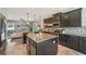 Modern kitchen features a spacious island and stainless steel appliances at 4151 Little Gap Loop, Ellenton, FL 34222