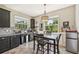 Cozy eat-in kitchen featuring stainless steel appliances, granite countertops, and ample natural light at 4151 Little Gap Loop, Ellenton, FL 34222