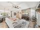 Cozy living room boasts a large sectional, tv, and easy access to the kitchen at 4151 Little Gap Loop, Ellenton, FL 34222