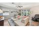 Comfortable living room featuring a large sectional and sliding glass doors at 4151 Little Gap Loop, Ellenton, FL 34222