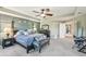 Spacious main bedroom with a decorative accent wall and ensuite bathroom at 4151 Little Gap Loop, Ellenton, FL 34222