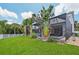 A covered pool with tropical landscaping surrounding at 4151 Little Gap Loop, Ellenton, FL 34222