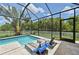 A covered pool area with lounge chairs at 4151 Little Gap Loop, Ellenton, FL 34222