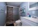 Cozy bathroom featuring a tiled shower with glass door and updated vanity at 4403 W Minnehaha St, Tampa, FL 33614