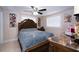 Bedroom with a paneled headboard and two windows at 4403 W Minnehaha St, Tampa, FL 33614