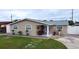 Charming single-story home with a cozy front porch and well-maintained lawn at 4403 W Minnehaha St, Tampa, FL 33614