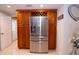 Kitchen highlights stainless steel refrigerator and custom wood cabinets and shelving at 4403 W Minnehaha St, Tampa, FL 33614