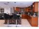 Open kitchen design with breakfast bar, modern cabinets, and stainless-steel appliances at 4403 W Minnehaha St, Tampa, FL 33614