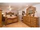 Bedroom featuring a carved wooden bed frame with dresser and a decorative mirror at 4403 W Minnehaha St, Tampa, FL 33614